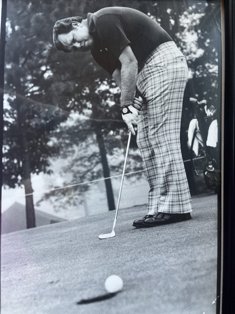 Orville Moody sinks a putt.